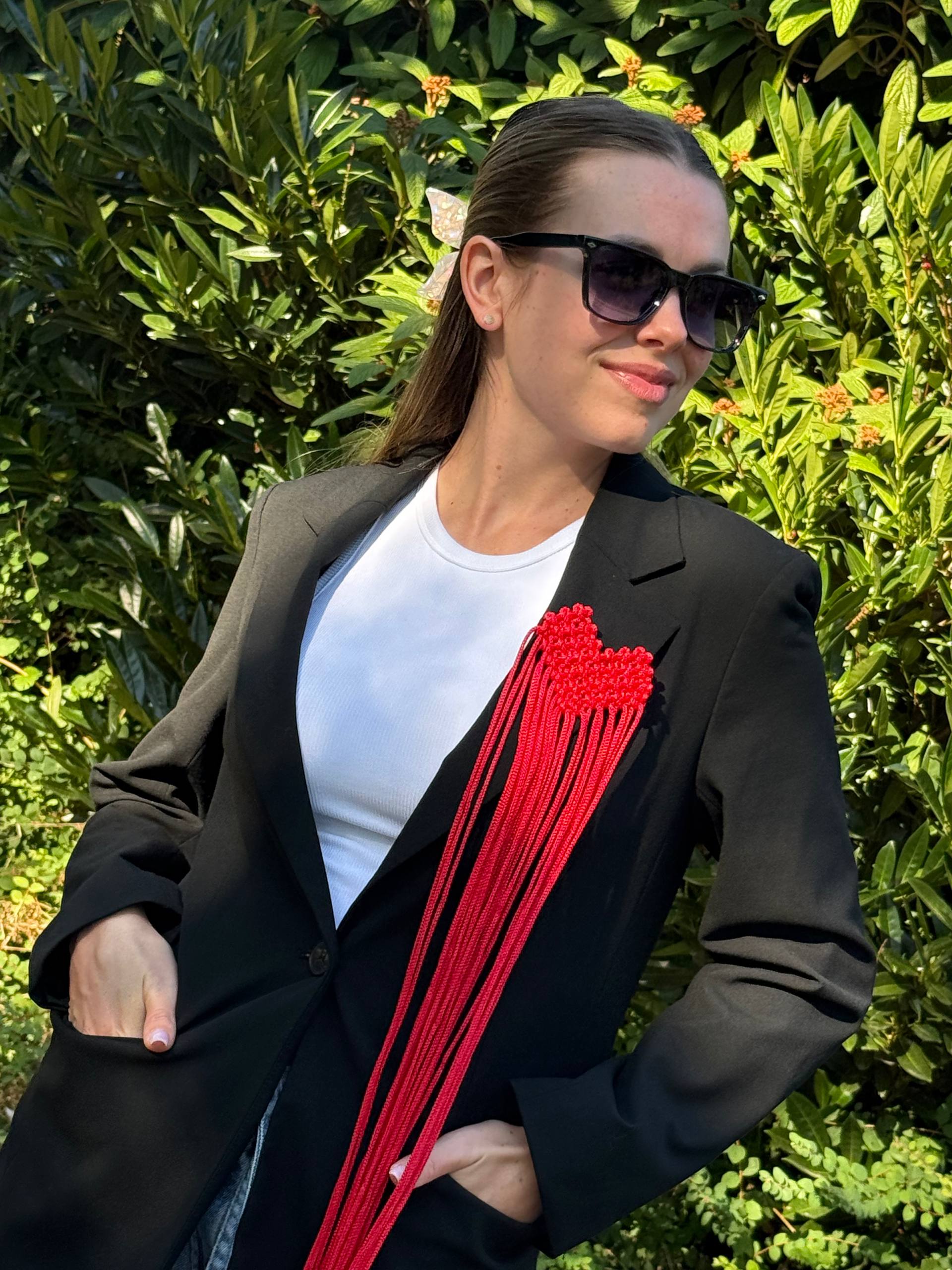Red Fringe Brooch — worn on black blazer by model