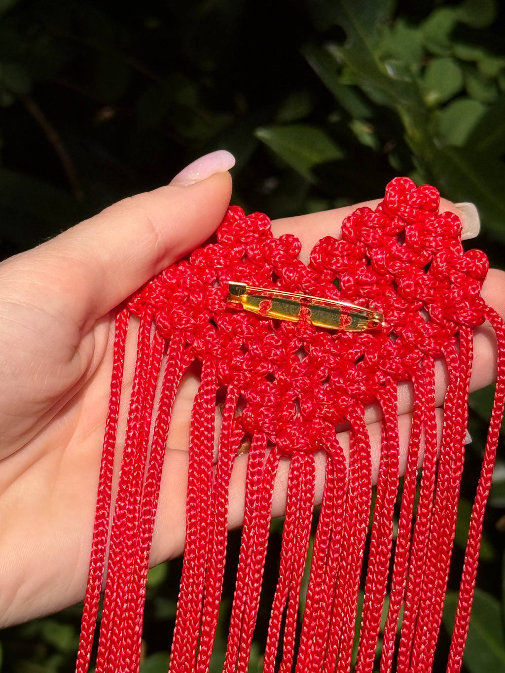 Red Fringe Brooch — back clasp detail in hand