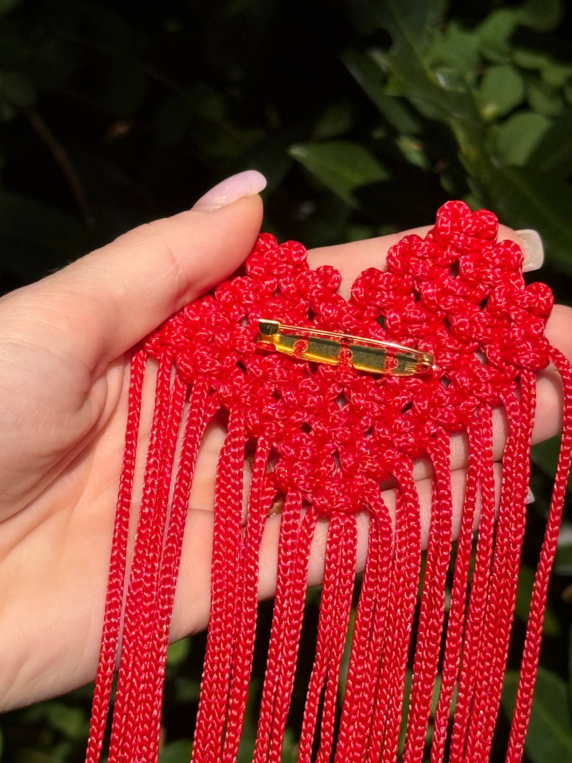 Red Fringe Brooch — back clasp detail in hand
