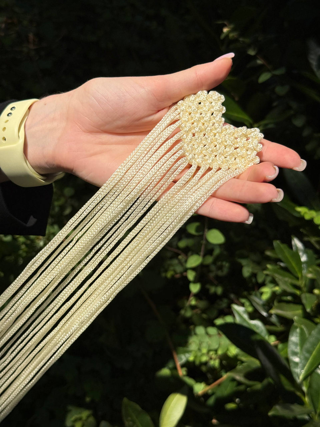 Pearl Cream Fringe Brooch — front detail in hand