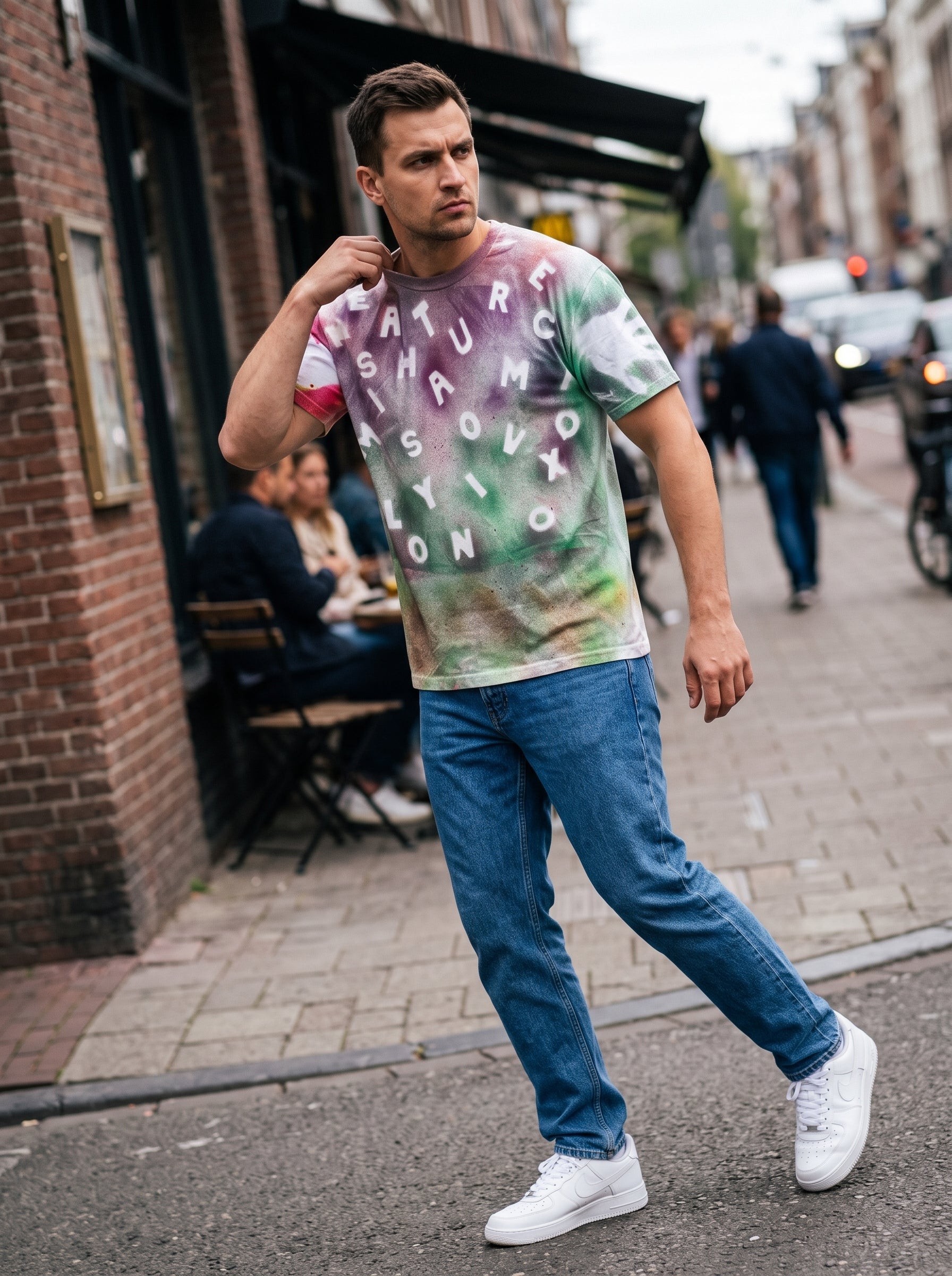 Acid Wash Letter Tee — handmade tie-dye t-shirt with scattered letters, worn on Amsterdam street