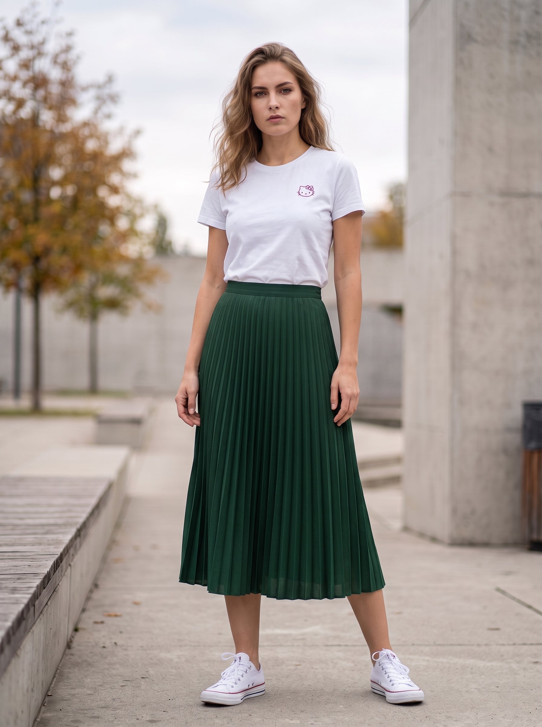Forest Green Pleated Midi Skirt — front view worn by woman outdoors