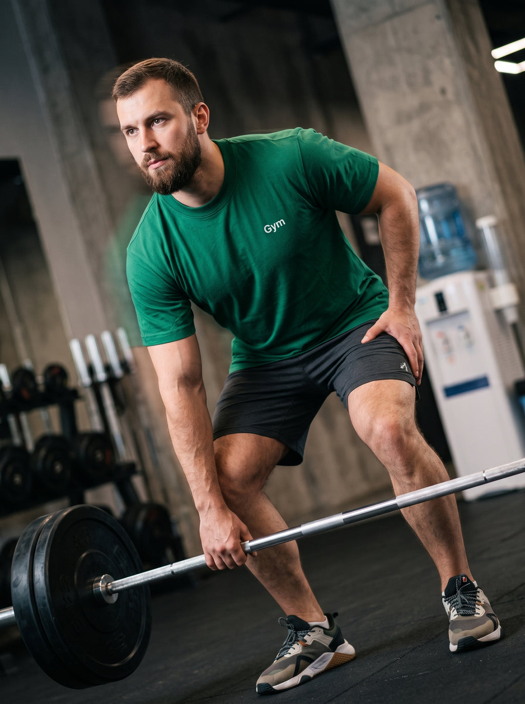 Gym Tee — forest green t-shirt with white Gym print worn by man lifting barbell in gym