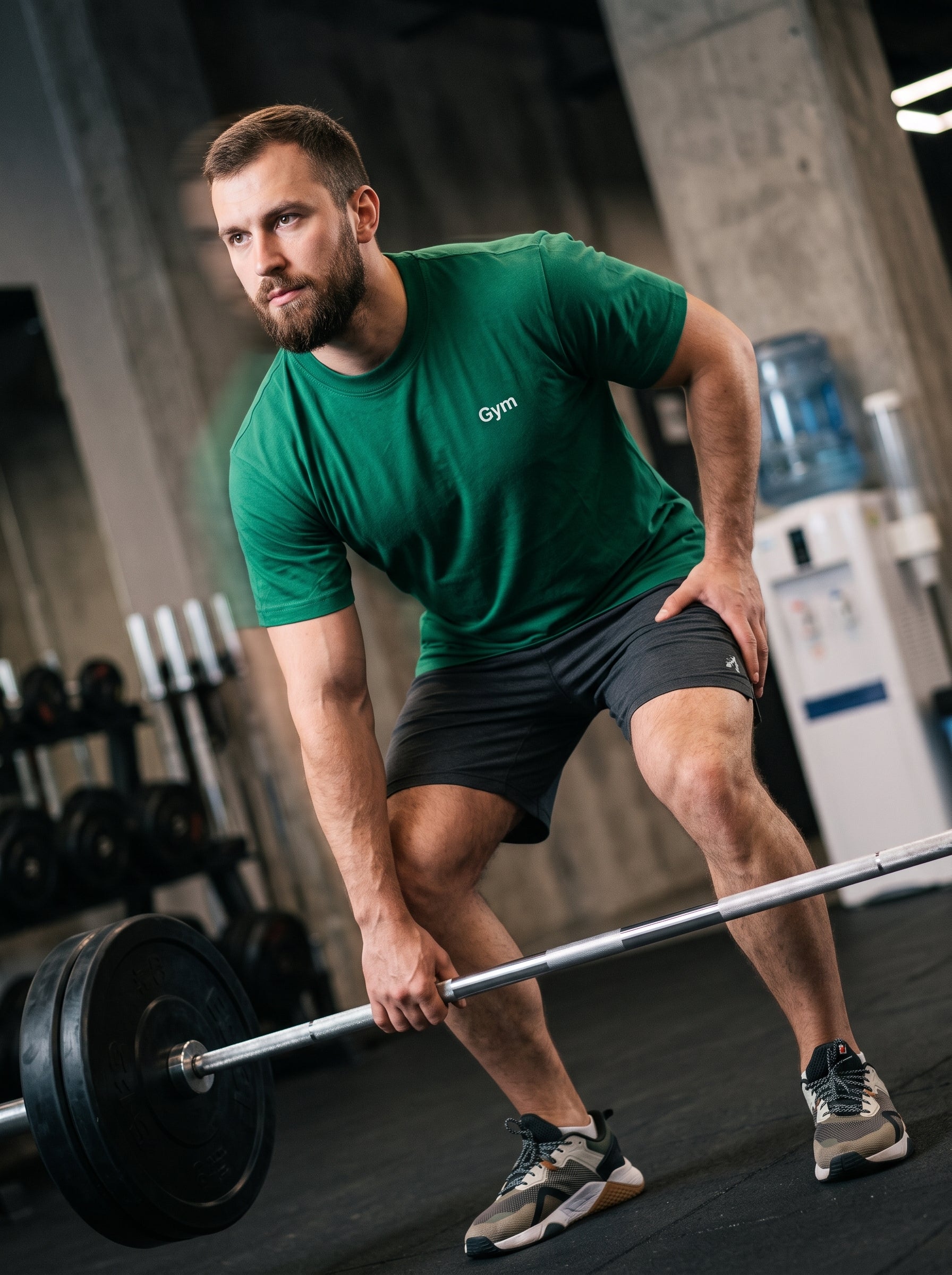 Gym Tee — forest green t-shirt with white Gym print worn by man lifting barbell in gym