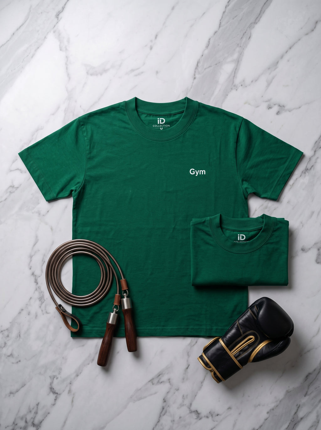 Gym Tee — forest green t-shirt flat lay with jump rope and boxing gloves on marble