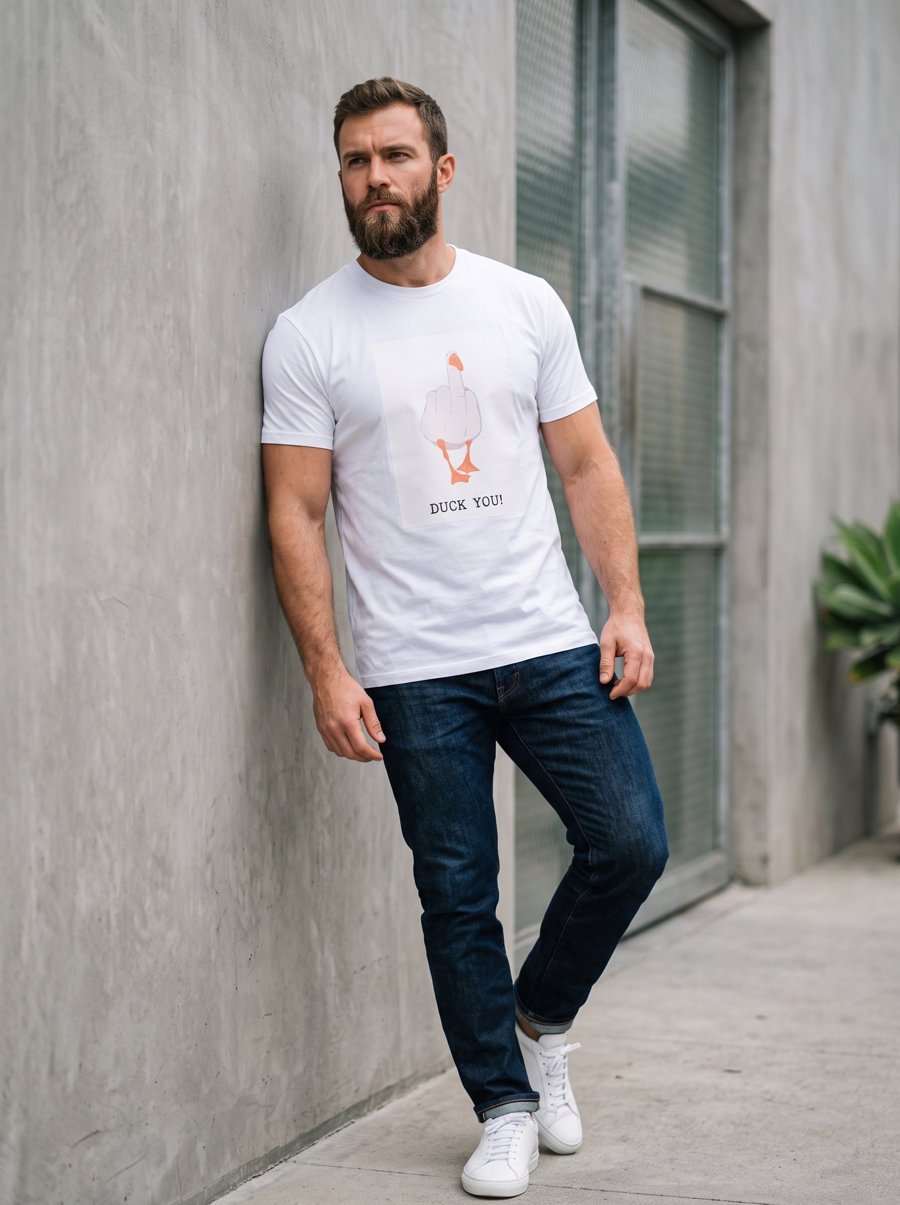 Duck You Tee — white t-shirt with duck illustration and DUCK YOU text worn by bearded man