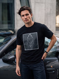 Pray Tee — black t-shirt with praying hands and rosary graphic worn by man next to Porsche