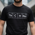 TeCHNo Elements Tee — close-up of periodic table print on black t-shirt
