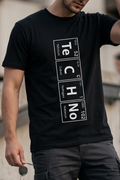 TeCHNo Elements Tee — close-up of vertical periodic table print on black t-shirt