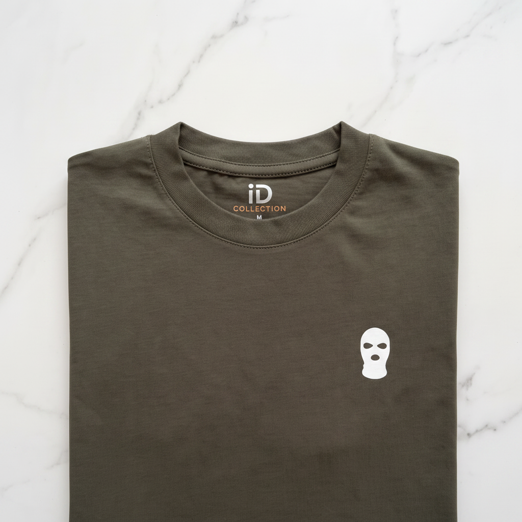 ID Ski Mask Tee — close-up of white ski mask graphic print on dark olive t-shirt